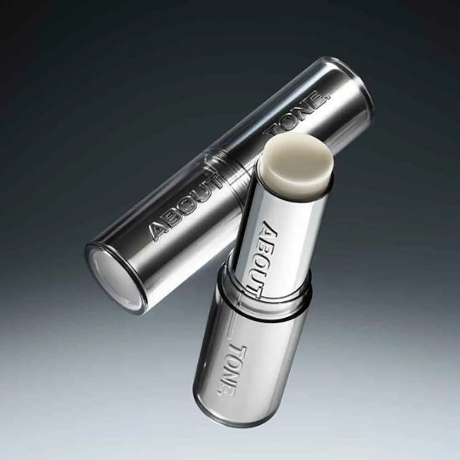 ABOUT TONE Blur Lasting Stick Primer de la marque ABOUT TONE, tube et stick effet floutant sur fond sombre.