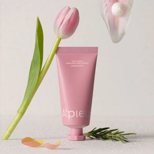 A'PIEU Juicy Pang Perfume Hand Cream 30ml de la marque A'PIEU, tube rose sur fond clair avec tulipes