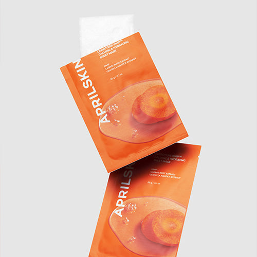 Décris l'image en français en mentionnant APRILSKIN Carrotent IPMP Calming & Hydrating Sheets Mask, feuilles masque orange sur fond clair.