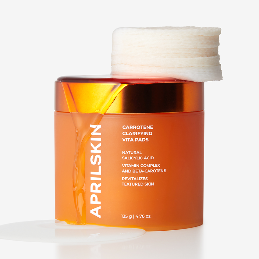 APRILSKIN Carrotene Clarifying Vita Pad de la marque APRILSKIN, pot orange avec tampons, fond clair, photo produit.