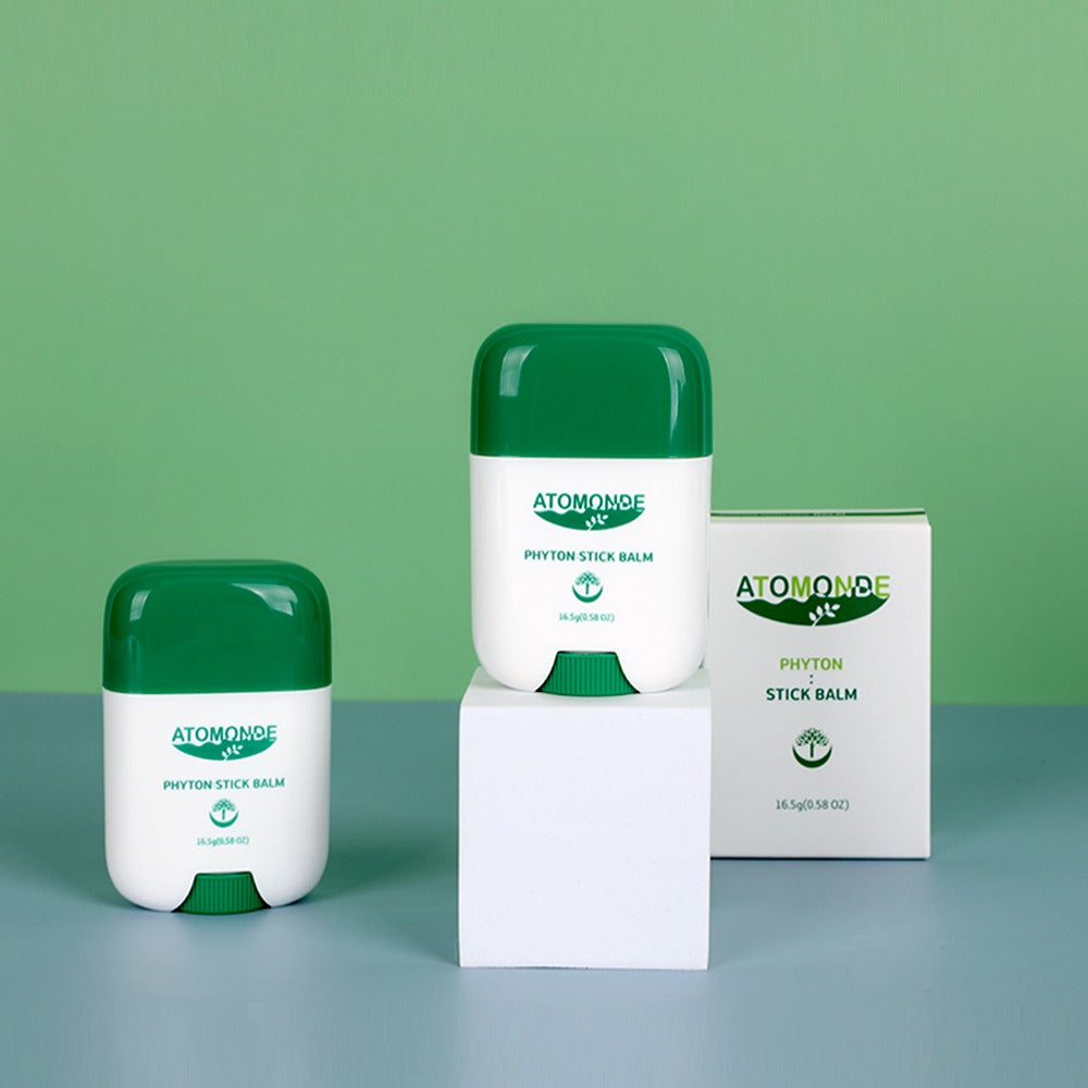 ATOMANDE Phyton Stick Balm 16.5g 1ea, produits sur fond vert, vue packshot, marque ATOMANDE en contexte visuel.