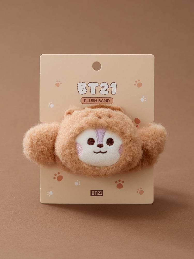 BT21 BABY MORE FLUFFY FACE PLUSH BAND : peluche visage bébé BT21 sur carte, décorée pattes, fond beige.