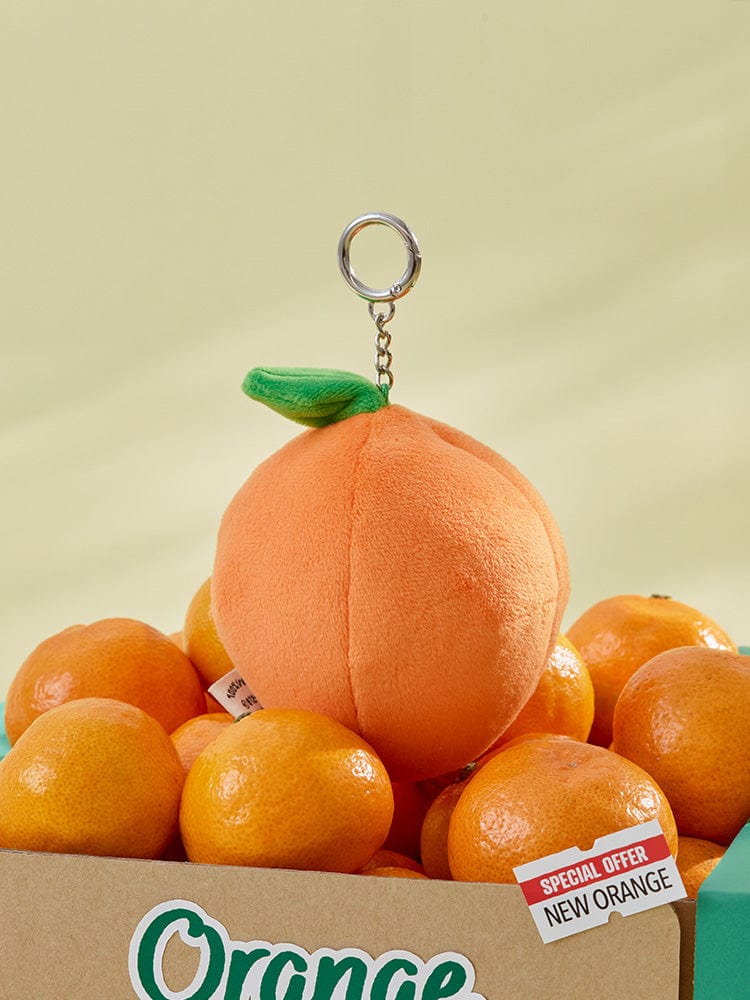 BT21 COOKY BABY PLUSH KEYRING ORANGE PARTY : porte-clés COOKY orange, fond jaune, style K-pop LINE FRIENDS sous licence.