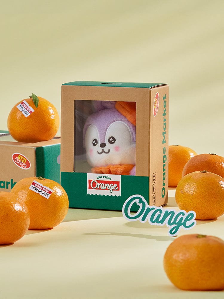 BT21 MANG BABY PLUSH ORANGE PARTY : peluche Mang orange party, personnage BT21 sous licence LINE, en boîte, décor agrumes.