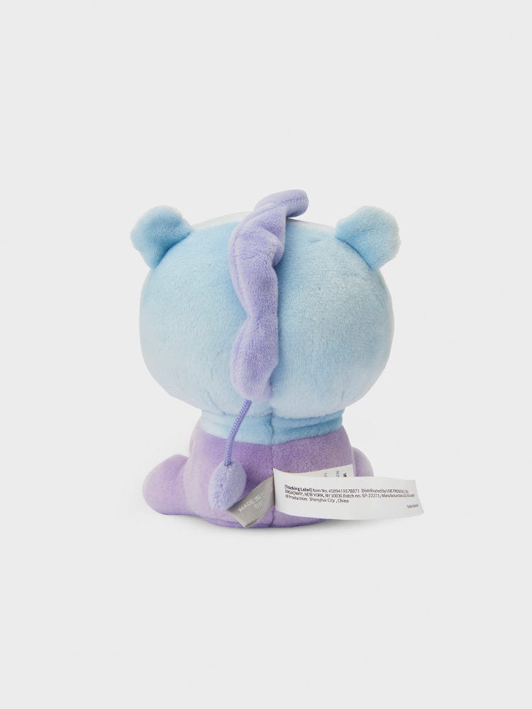 BT21 MANG minini LYING DOLL officielle, peluche poney danseur masqué MANG, douceur bleue et violette sur fond clair.