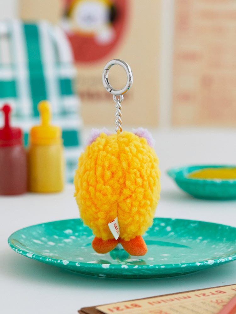 BT21 MANG minini PLUSH KEYRING BUNSIK : porte-clés peluche MANG jaune sur assiette, univers K-pop BT21 officiel.