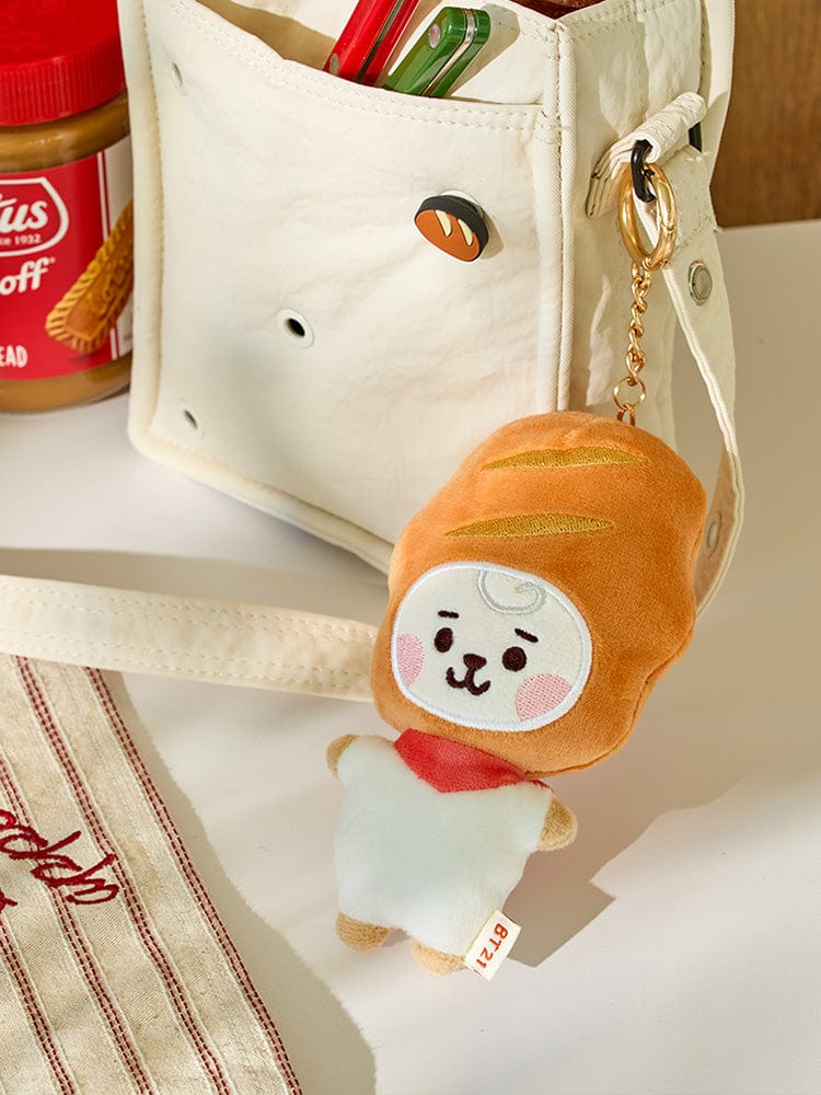 BT21 RJ BABY PLUSH KEYRING BAKERY SHOP : porte-clés peluche RJ LINE FRIENDS, sur sac crème, ambiance boulangerie K-pop