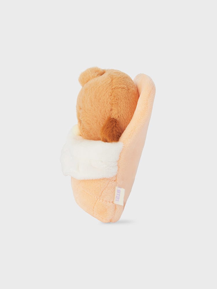 BT21 SHOOKY NEWBORN BABY PLUSH, peluche officielle LINE, biscuit malicieux Suga BTS, sur fond blanc, vue de côté.