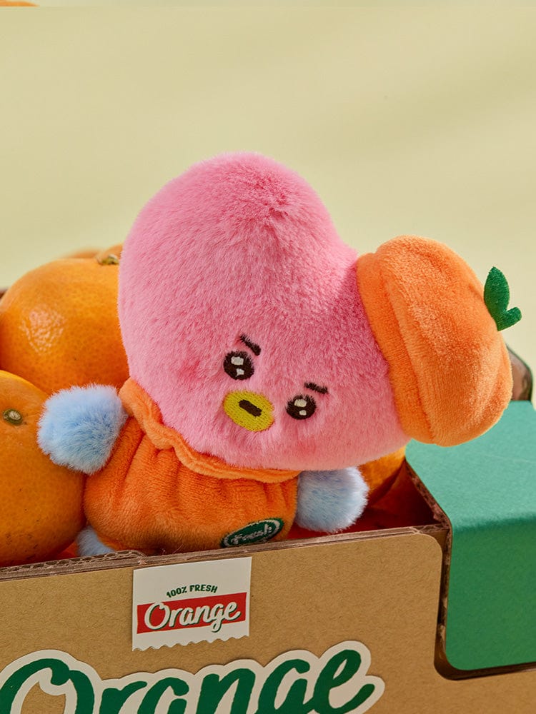 BT21 TATA BABY PLUSH ORANGE PARTY peluche officielle orange, personnage rose sur boîte cadeau, décor chambre (V BTS)