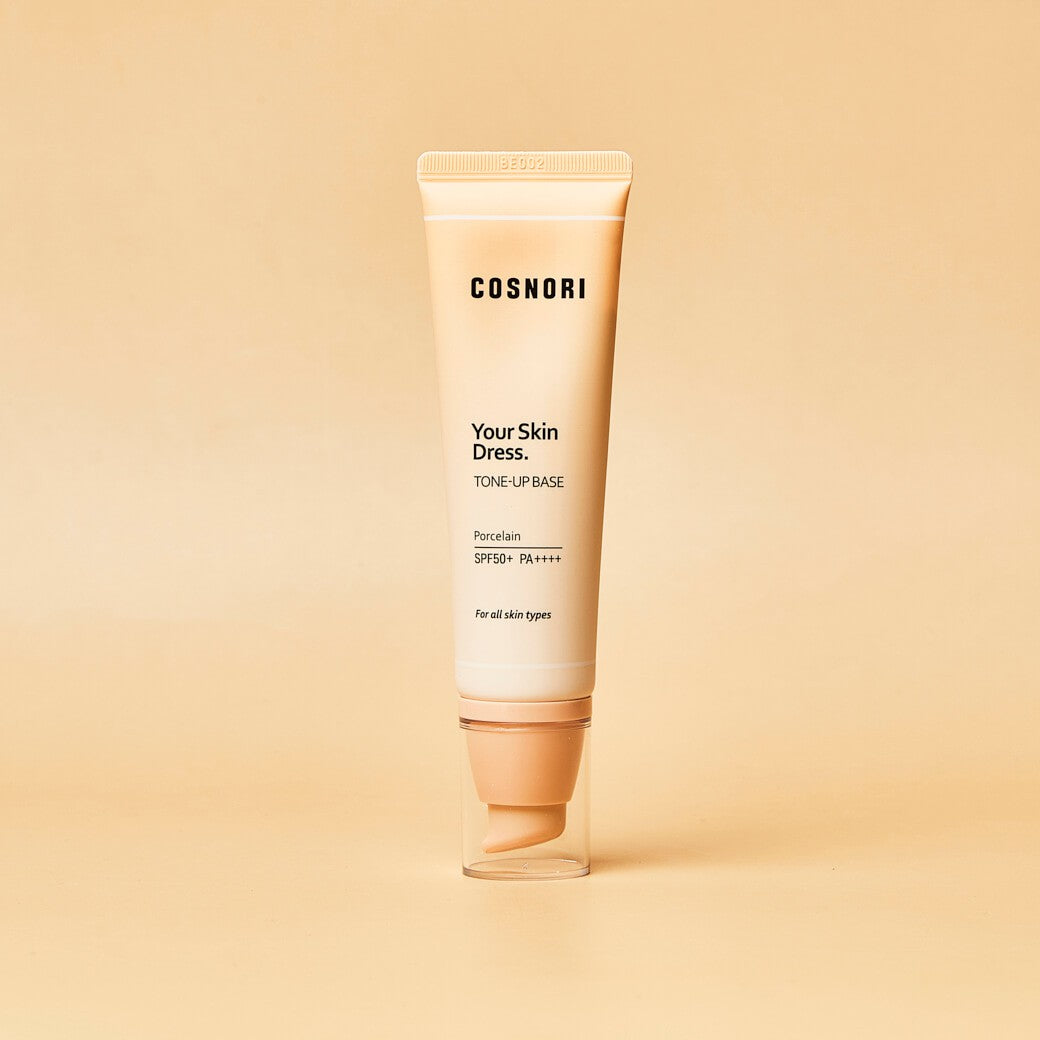 COSNORI Your Skin Dress Tone-Up Base 50ml, tube crème sur fond beige, marque COSNORI en contexte cosmétique.