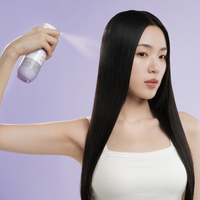 Femme utilisant Dr. G Scalp Lab Sera-LPT Clinic No-Wash Treatment 200mL pour soins capillaires.