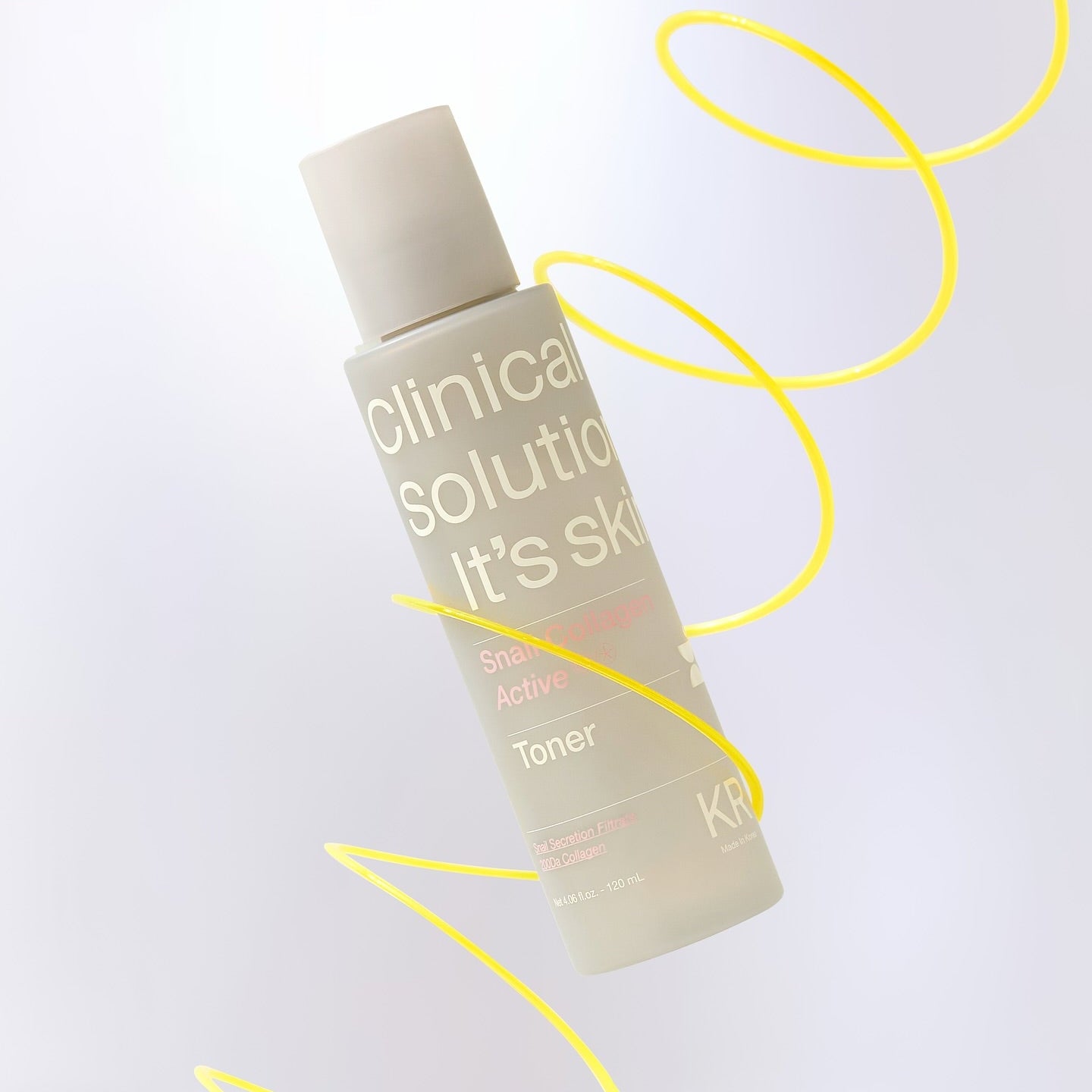 Flacon de toner IT'S SKIN Snail Collagen Active 120ml, avec spirales jaunes, design élégant, soin de la peau efficace.