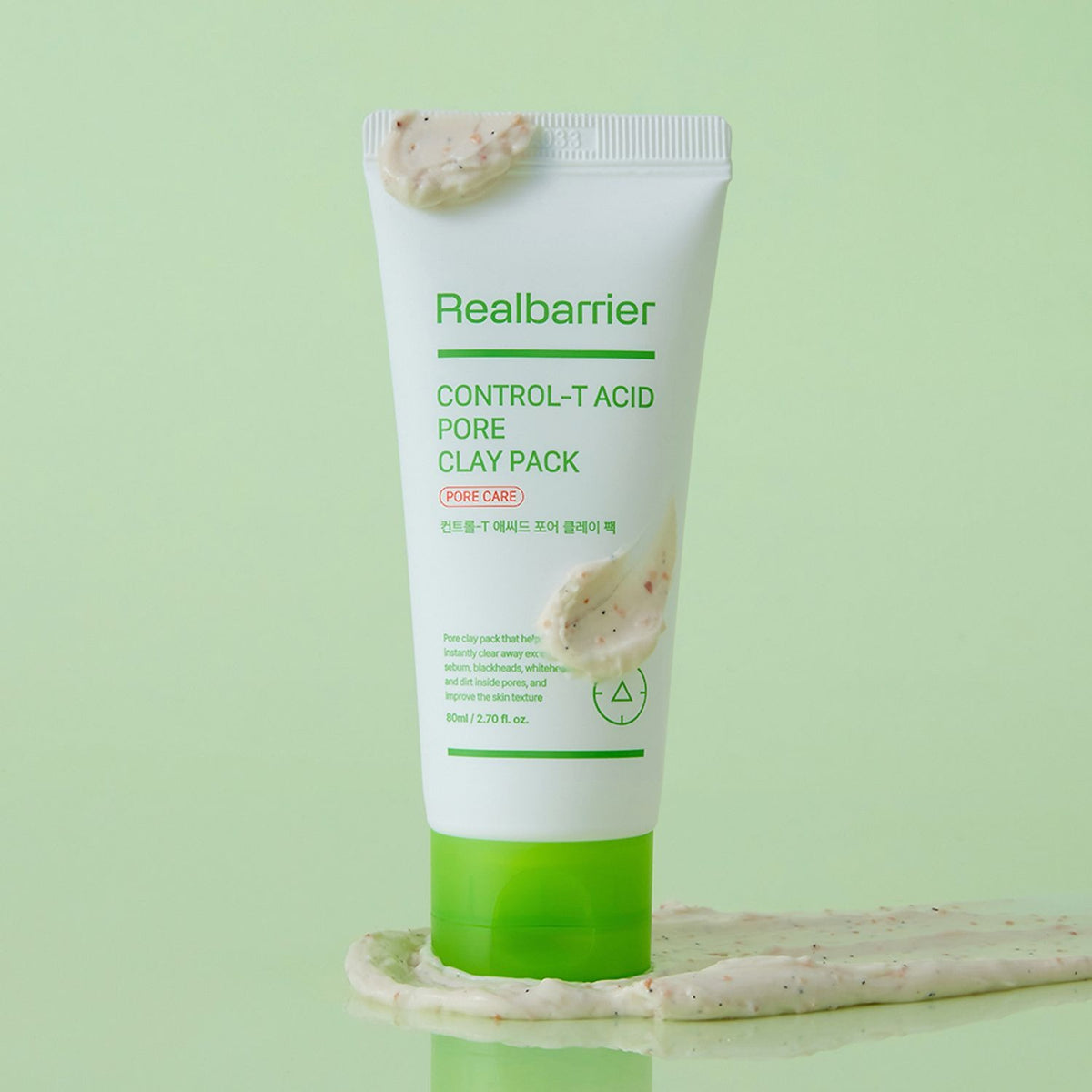 REAL BARRIER Control-T Acid Pore Clay Pack 80ml de Realbarrier, tube sur fond vert pastel, appliqué avec argile.
