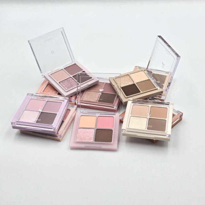 ROMAND Romand Better Than Eyes, palette maquillage yeux sur fond clair avec compartiments de fards ouverts