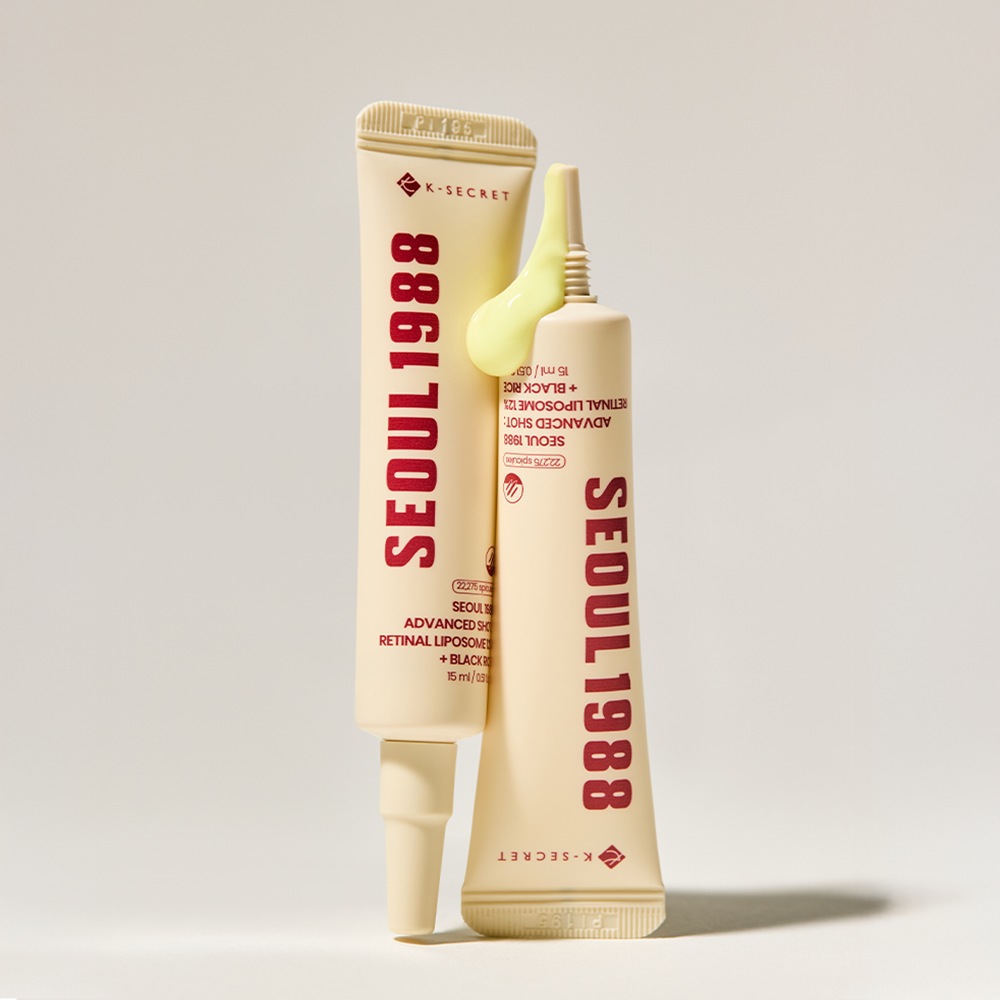 SEOUL 1988 Advanced Retin-R Shot 15ml de K-Secret, tube crème jaune sur fond clair, style produit beauté.