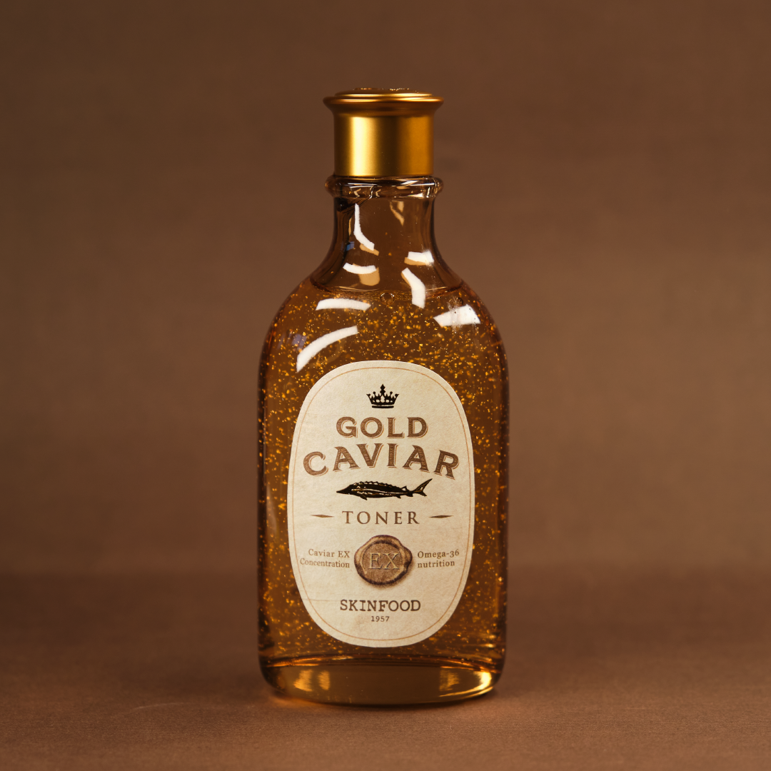 SKINFOOD Gold Caviar EX Toner 145ml de la marque SKINFOOD : flacon doré sur fond brun, effet caviar en gros plan.