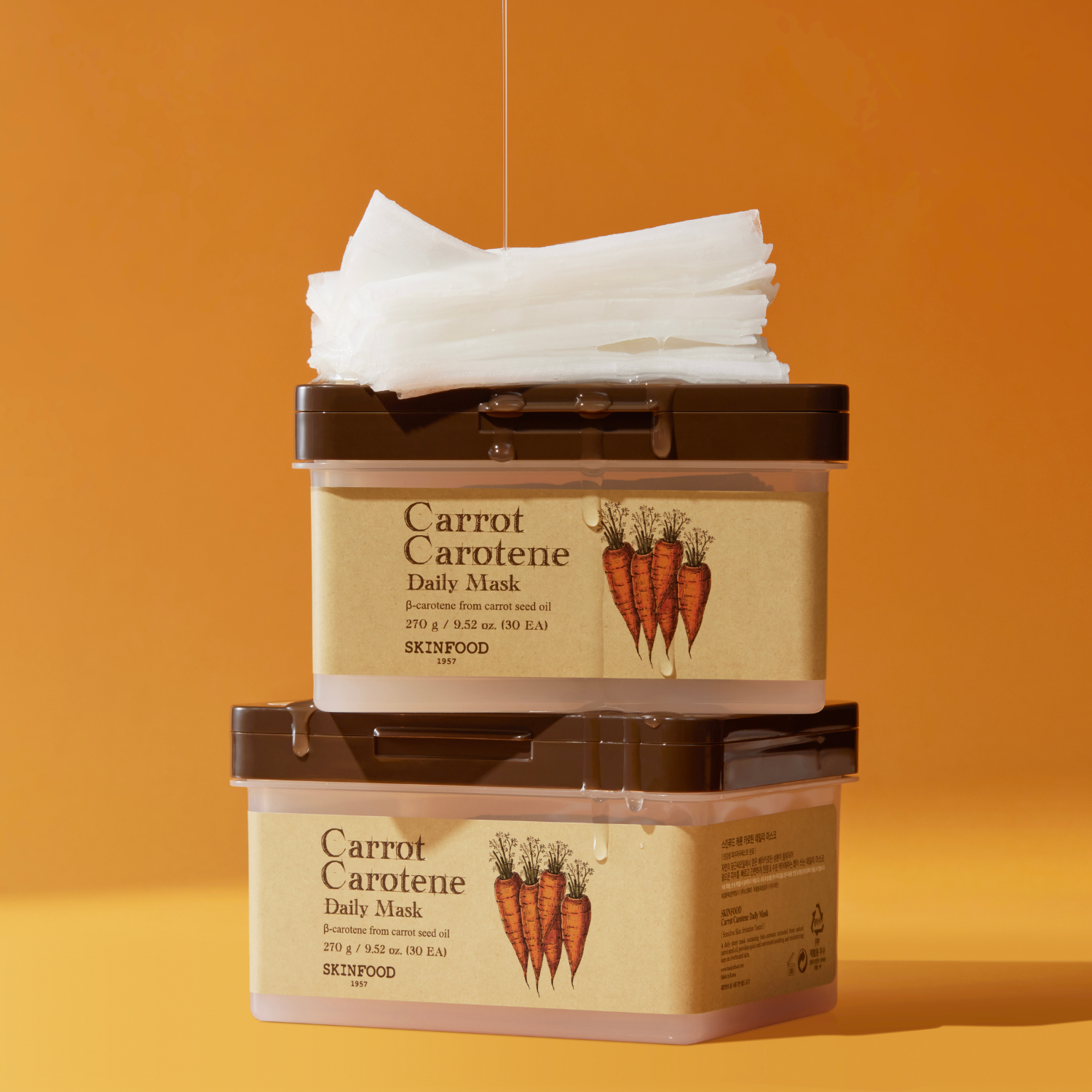 SKINFOOD Carrot Carotene Daily Mask 30p 270g, masque soin à la carotte sur fond orange, packaging SKINFOOD.