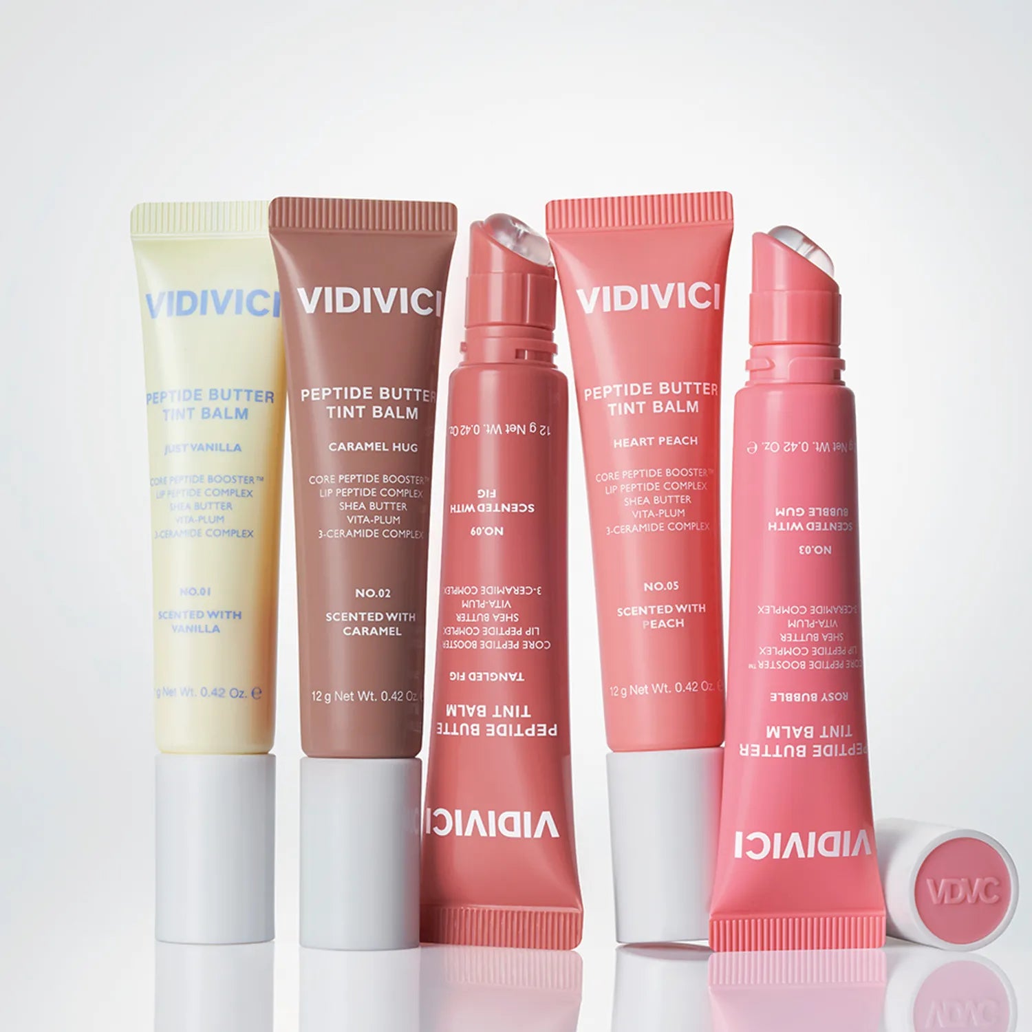 Produits VIDIVICI Peptide Butter Tint Balm en différentes teintes affichés sur fond neutre.