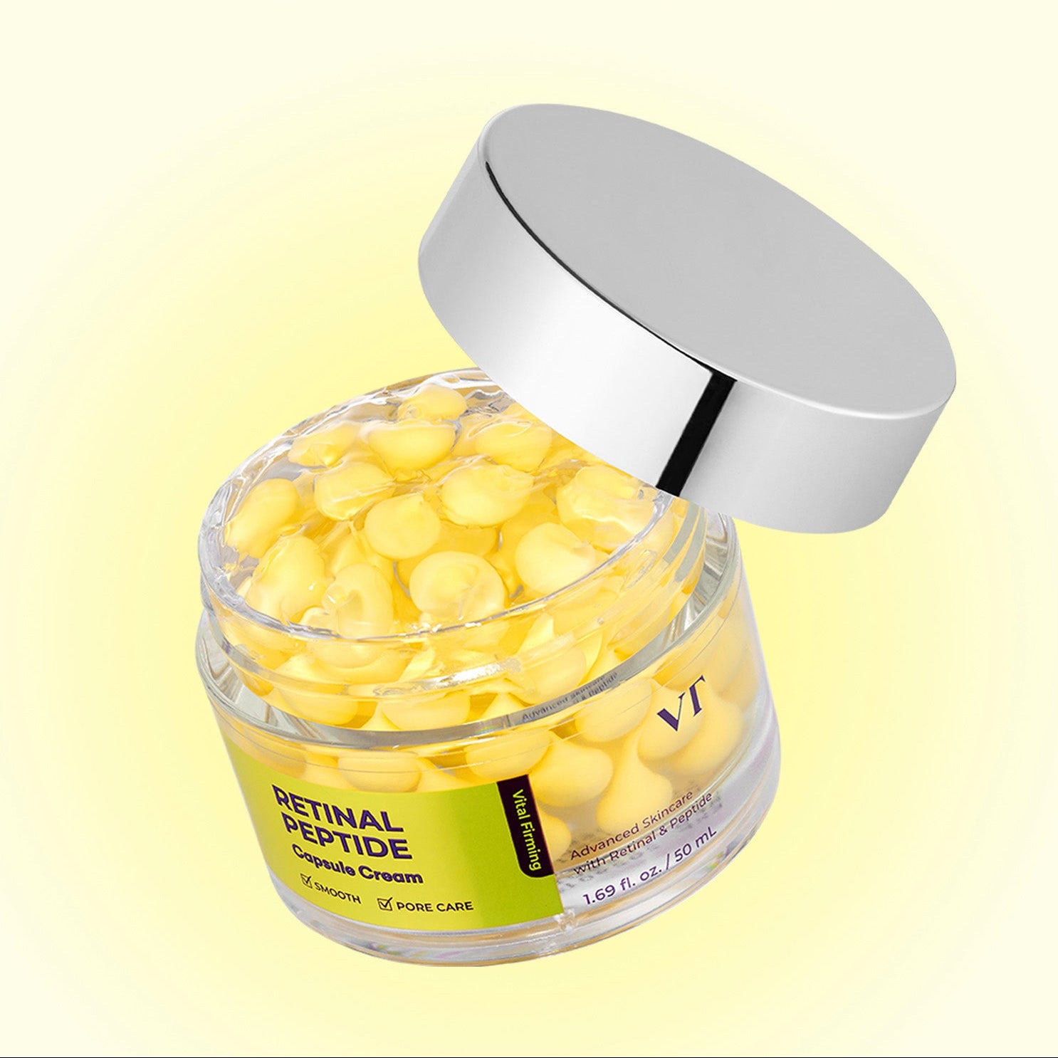 Décris l'image en français : VT COSMETIC Retinal Peptide Capsule Cream 50ml, pot jaune, sur fond jaune, marque visible.