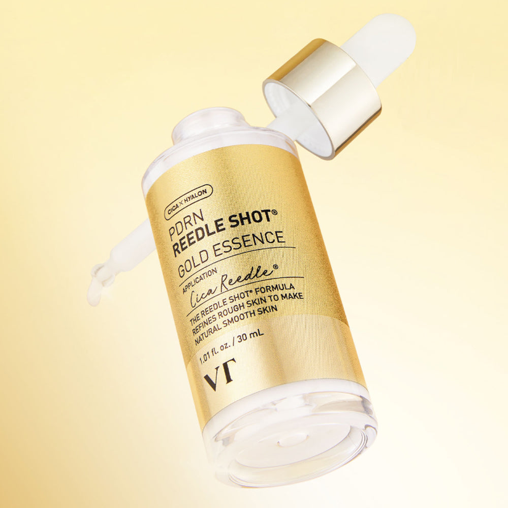 VT COSMETICS PDRN Riddle Shot Gold Essence 30ml de VT, flacon doré sur fond beige, contexte beauté skincare