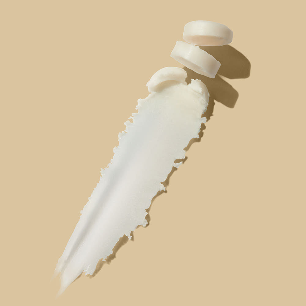 TALITHA KOUM HM+ Barrier Multi Balm 9g de la marque Talitha Koum sur fond beige, texture de baume blanc