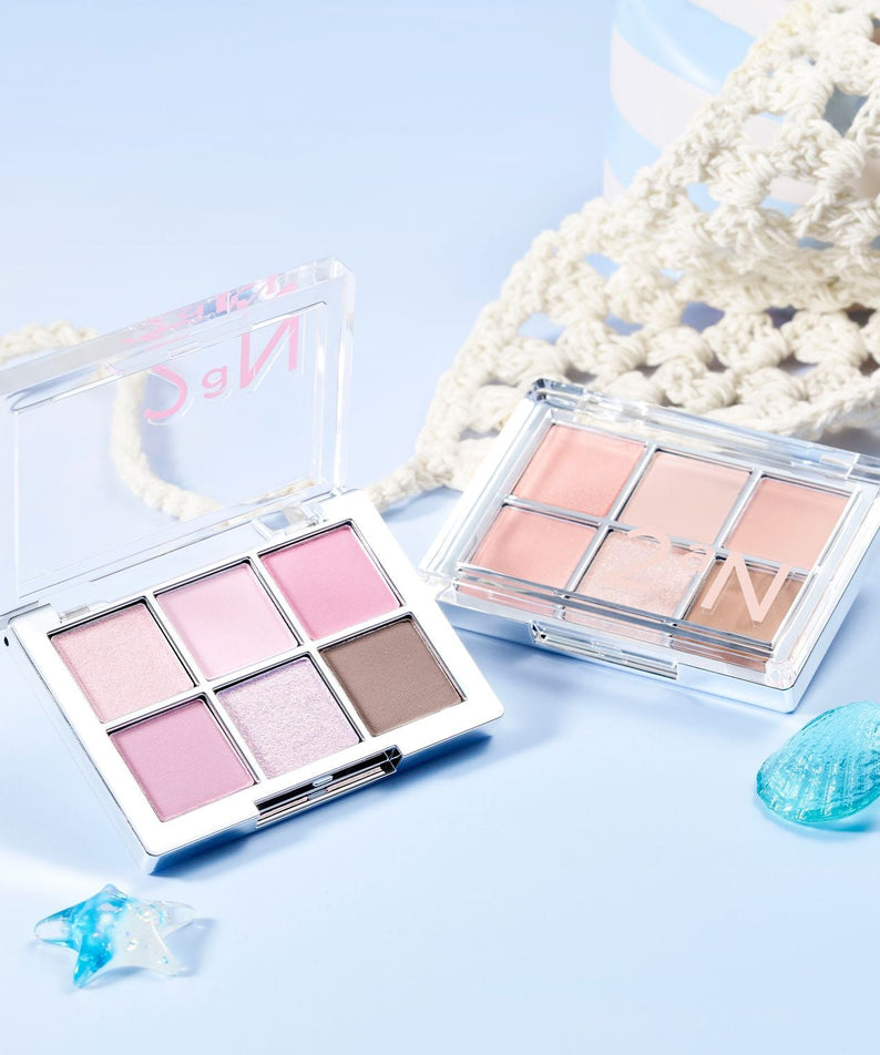 Palette pour les yeux 2AN Better Me Eye Palette 4.5g avec nuances pastel en arrière-plan, décoration marine.