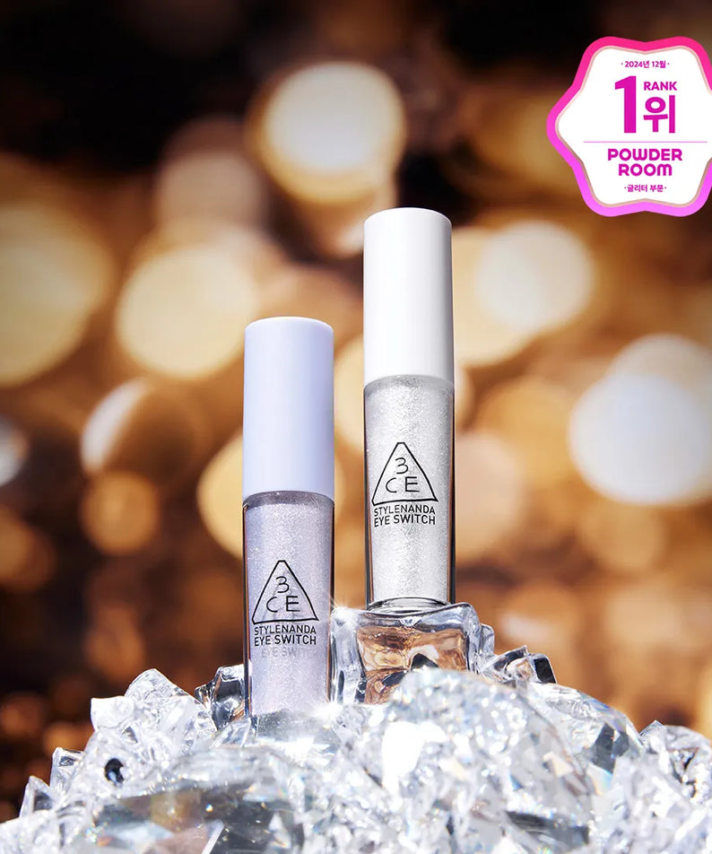 3CE  Eye Switch, fard pour les yeux 3CE en flacons sur glace, fond bokeh chaleureux, maquillage décoratif