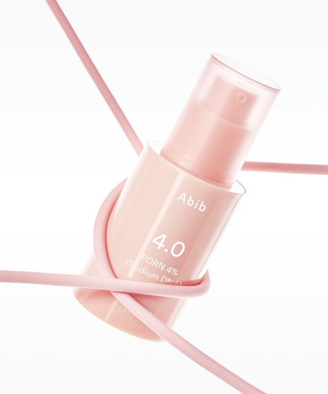 Décris l'image en français : ABIB  PDRN Glow Serum 30ml, flacon rose sur fond blanc avec lignes roses, cosmétique ABIB.