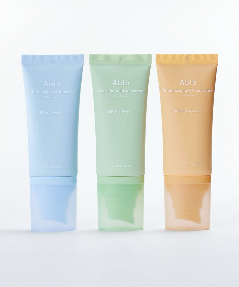 ABIB Sunscreen Tube 50ml 3 Types, trois tubes Abib sur fond clair : bleu, vert et beige, produits solaires.