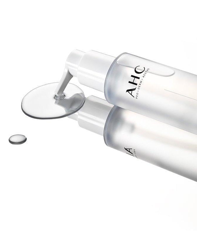 AHC Prep Reset Cleansing Oil 125ml : flacon AHC sur fond blanc, texture huile déversée, contexte cosmétique visage.