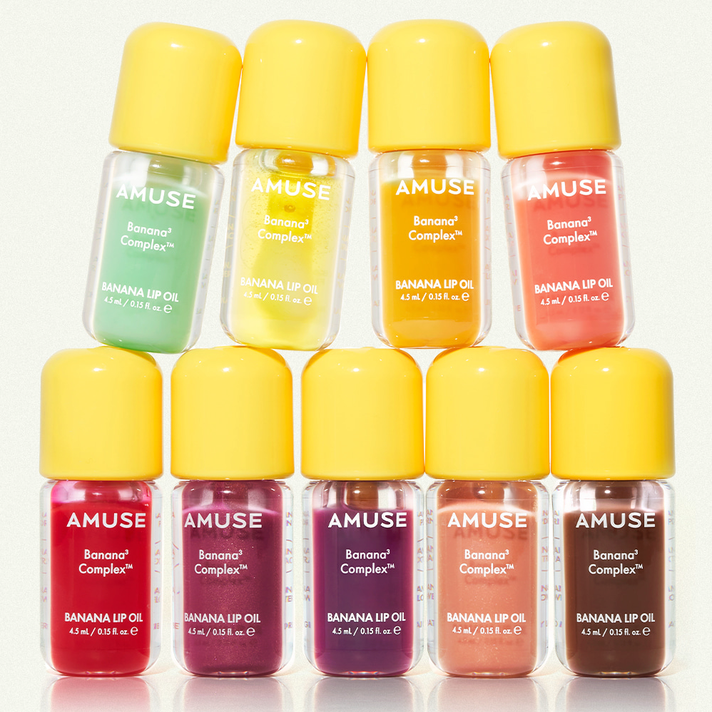 AMUSE Banana Lip Oil 4.5ml de la marque AMUSE, flacons colorés sur fond blanc, ambiance cosmétique.
