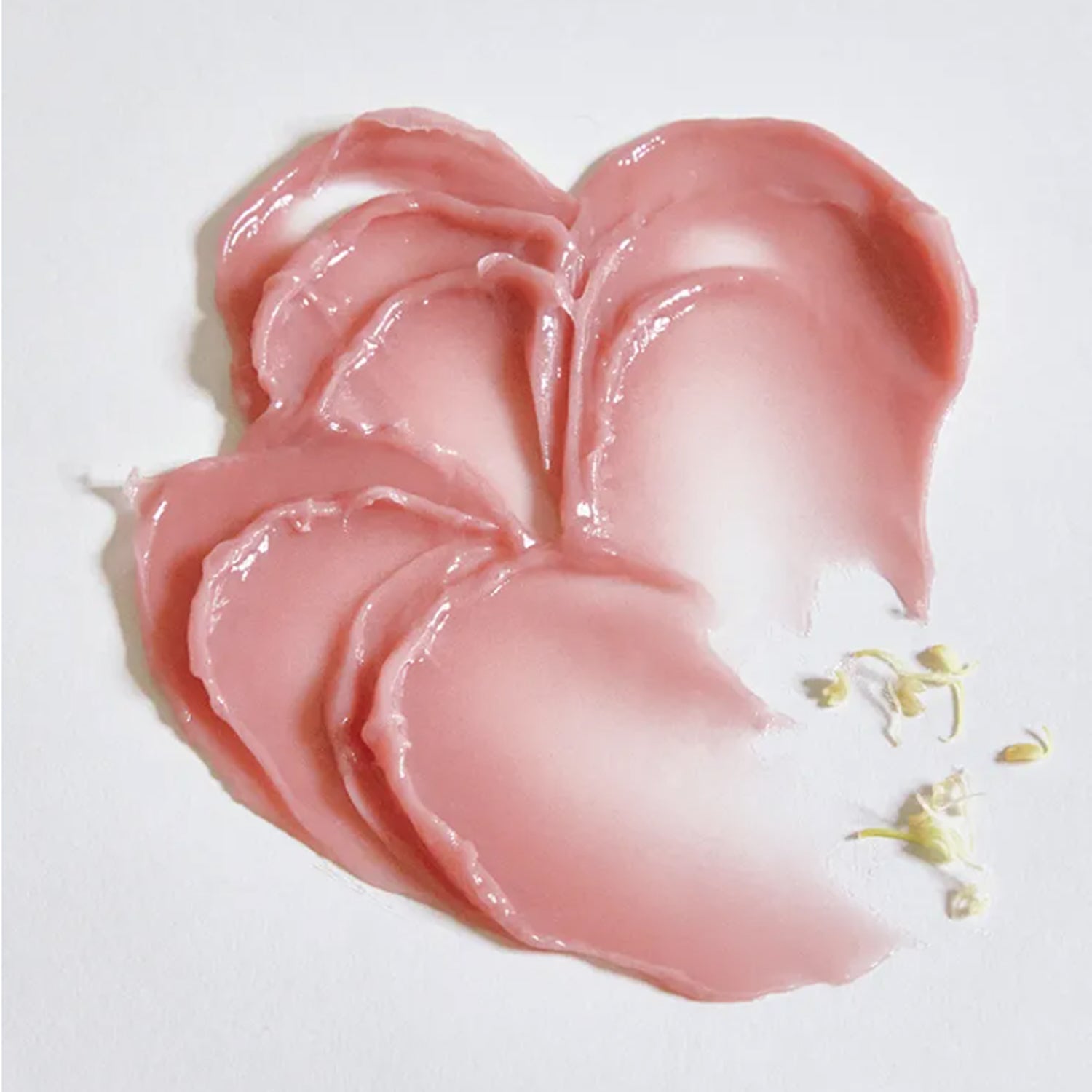 ANILLO Rose Glow Balm de la marque ANILLO, baume rose en gros plan sur fond blanc, texture brillante.