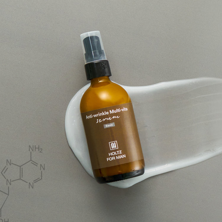 ANNA HOLTZ For Men Homme Men's Cosmetics Multivitamin Serum Essence 100ml, flacon en verre sur fond gris, contexte cosmétique
