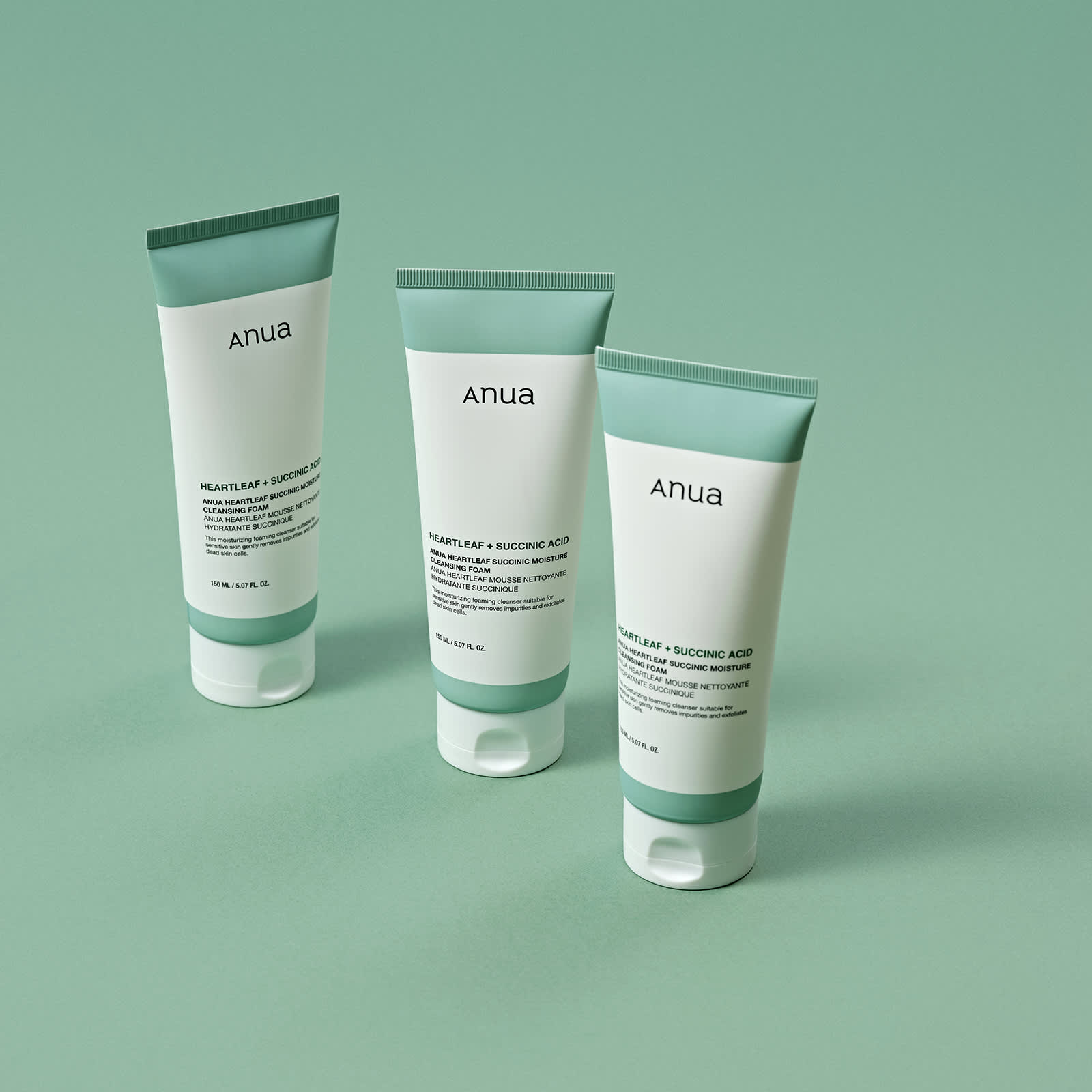ANUA Heartleaf + Succinic Acid Moisture Cleansing Foam 150ml, tubes Anua sur fond vert, présentation produit.