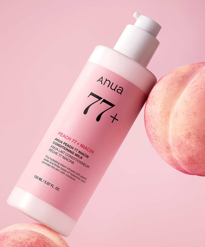 ANUA Peach 77 + Niacin Conditioning Milk 150ml, bouteille ANUA rose sur fond pastel avec fruits pêche, contexte beauté