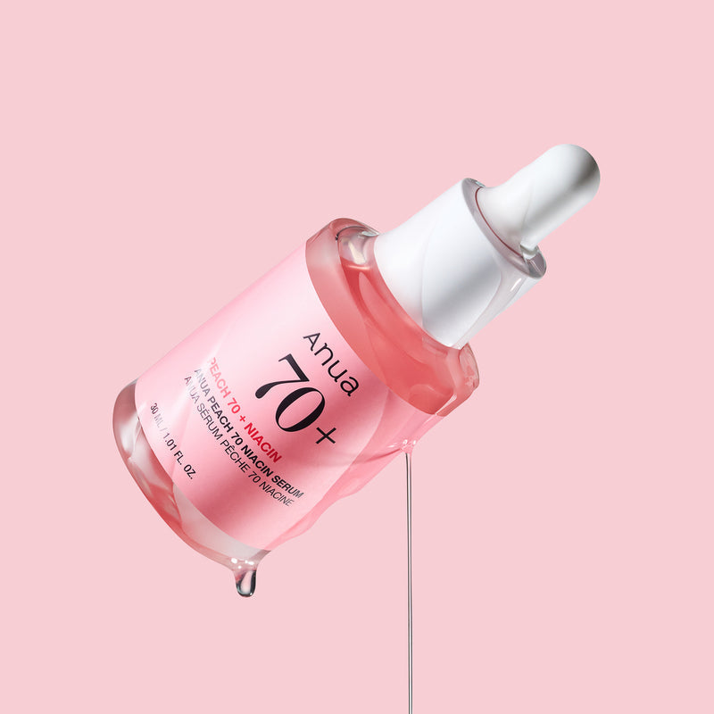 ANUA Peach 70 + Niacin Serum 30ml d’Anua, flacon sérum rouge sur fond rose, photo produit beauté.