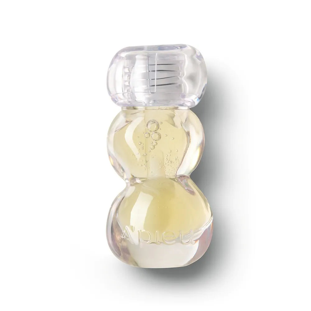 A'PIEU Jelly Honey Lip Oil 4g : flacon huileux translucide sur fond blanc, marque A'PIEU, contexte produit beauté