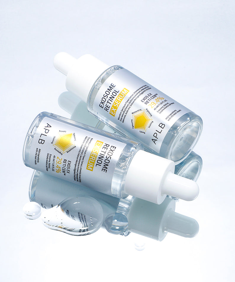 APLB Exosome Retinol EX Serum 40ml APLB sur fond clair avec sérums et bulles, photo produit en contexte beauté.