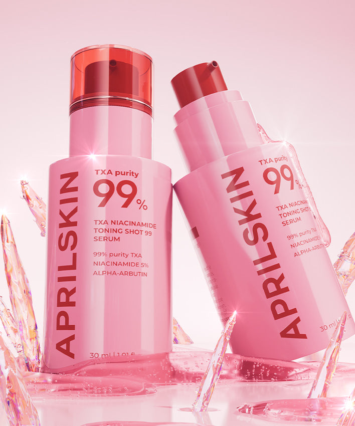 APRILSKIN TXA Niacinamide Toning Shot 99 Serum 30ml en flacons roses, marque affichée sur fond rose et glace brillante