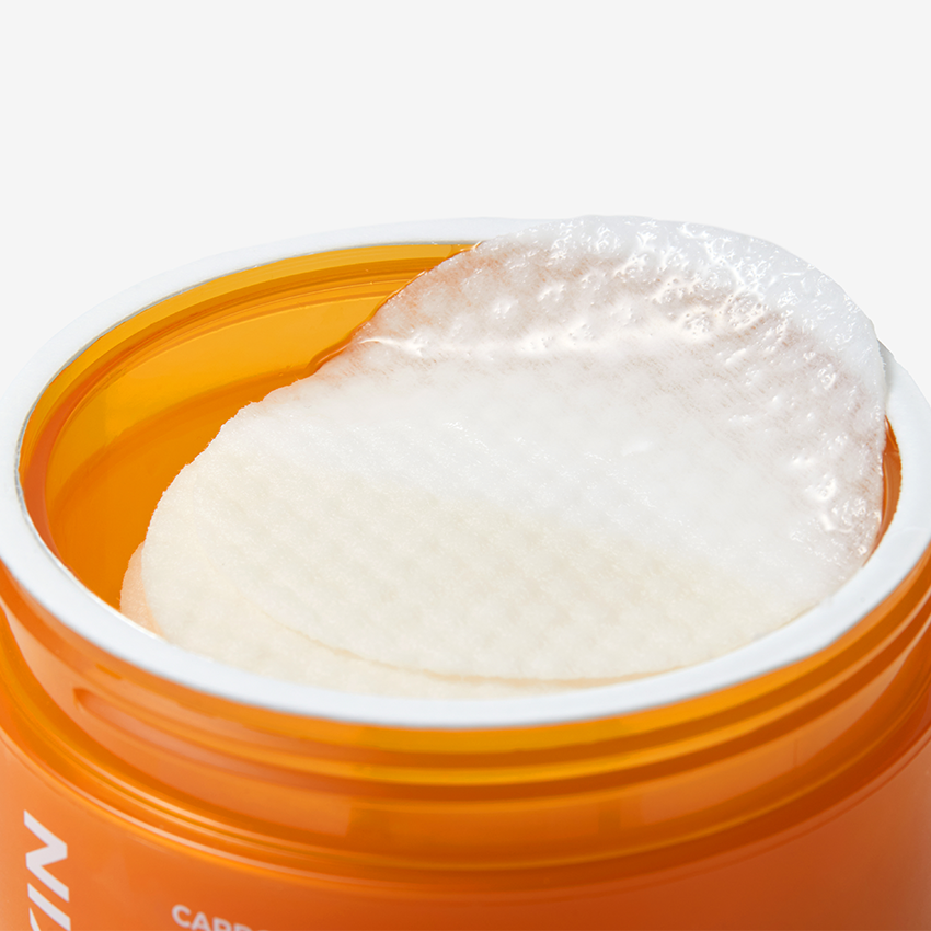 APRILSKIN Carrotene Clarifying Vita Pad, patch éclaircissant d’APRILSKIN, photo en pot orange sur fond clair