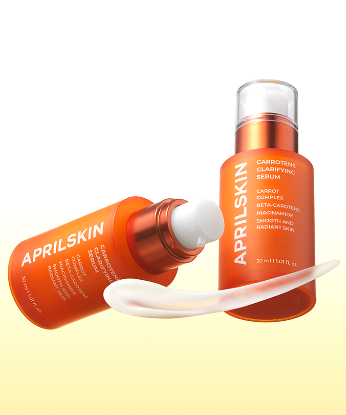 APRILSKIN Carrotene Clarifying Serum 30ml de la marque APRIL SKIN, flacons orange sur fond clair, contexte beauté.