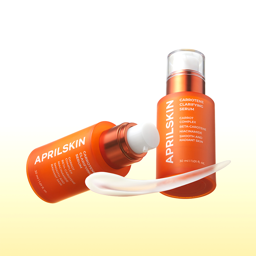 APRILSKIN Carrotene Clarifying Serum 30ml de la marque APRIL SKIN, flacons orange sur fond clair, contexte beauté.