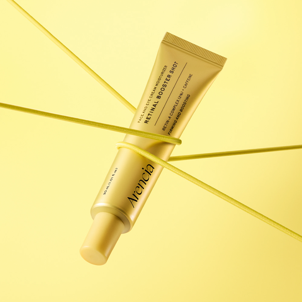 ARENCIA Retin-A Booster Shot 30ml, crème tube jaune sur fond jaune, visuel cosmétique moderne.