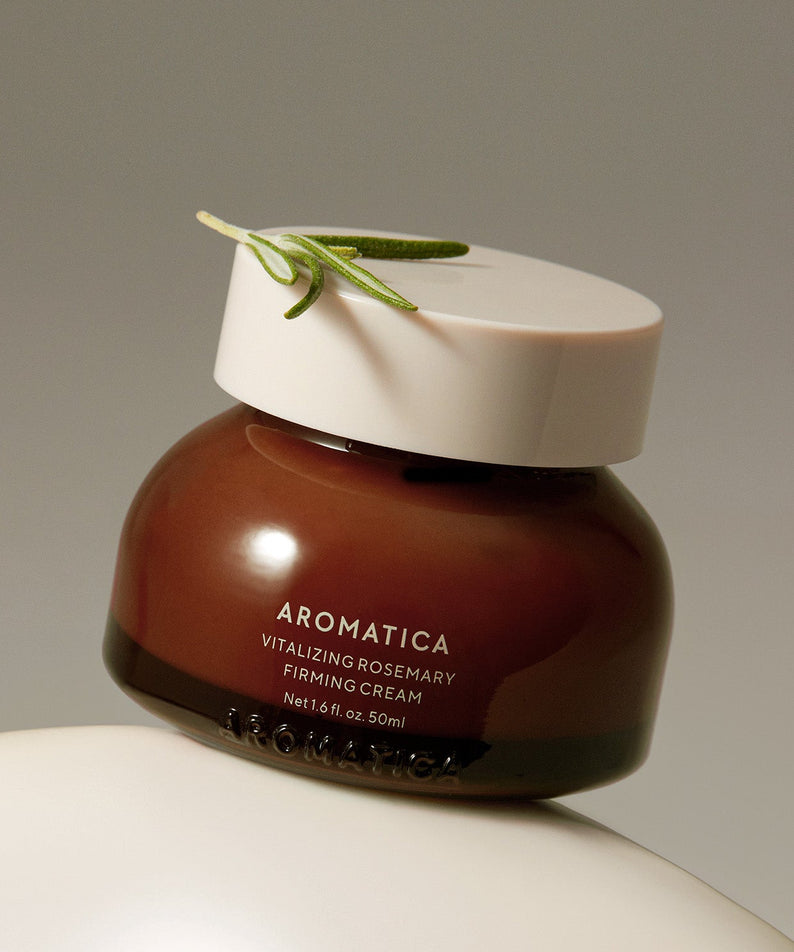 AROMATICA Vitalizing Rosemary Firming Cream 50ML en photo: pot brun sur fond clair, brin de romarin, marque AROMATICA