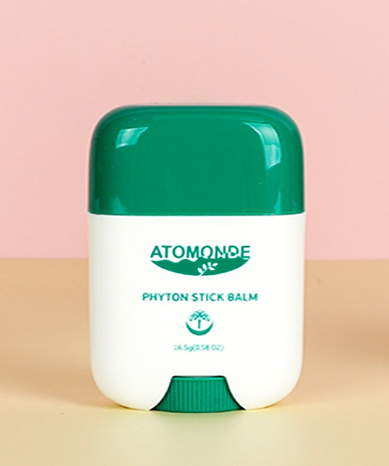 ATOMANDE Phyton Stick Balm 16.5g 1ea : baume stick vert sur fond rose et beige, présentation produit de la marque