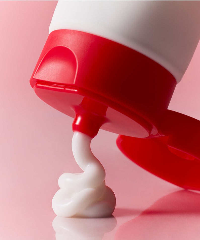 Tube de lotion pour visage ATOPALM Face Lotion 80ml avec crème blanche sur fond rose, hydratation et soin de la peau.