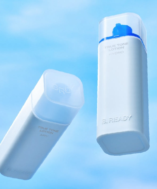 B.READY True Tone Lotion 2.0 40ml, lotion hydratante dans deux flacons sur fond bleu, idéal pour uniformiser le teint et rafraîchir la peau.