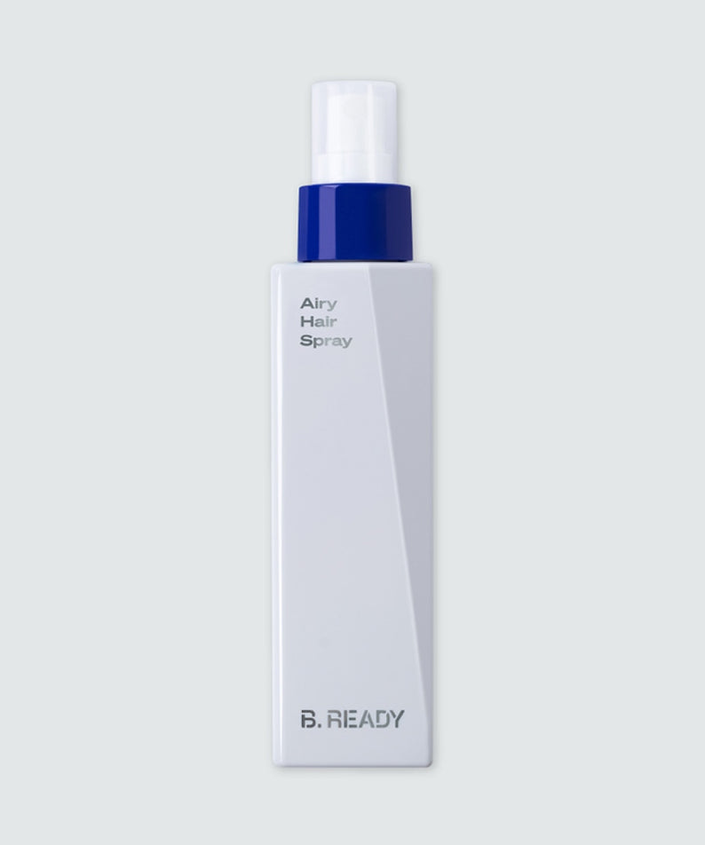 Flacon de BE.READY Airy Hair Spray 200ml en spray élégant pour cheveux volumineux, design moderne, packaging blanc et bleu.
