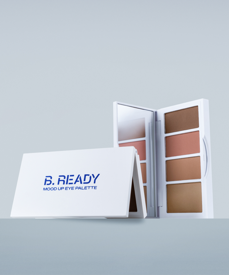 Palette yeux BE.READY Mood Up Shade Eye Palette 7g ouverte sur fond gris, présentant des teintes variées pour maquillage.