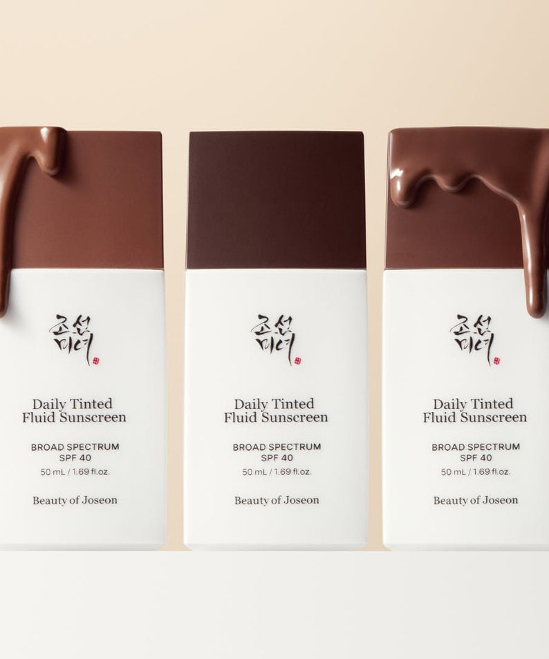 BEAUTY OF JOSEON Daily Tinted Fluid Sunscreen 50ml : trio de flacons teintés sur fond clair, marque Beauty of Joseon, visuel produit.